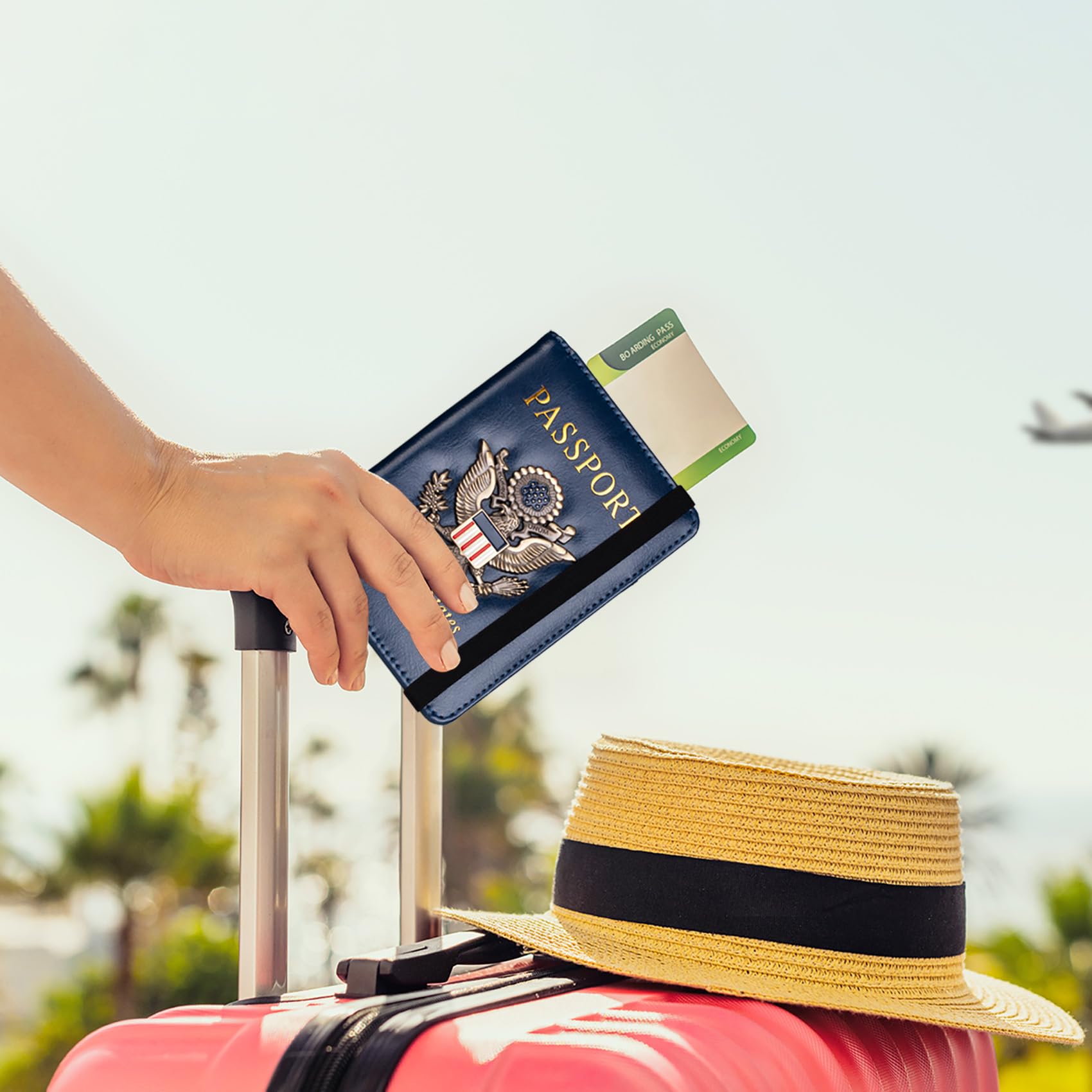 Navy passport travel wallet with a boarding pass held beside a suitcase, ready for a trip