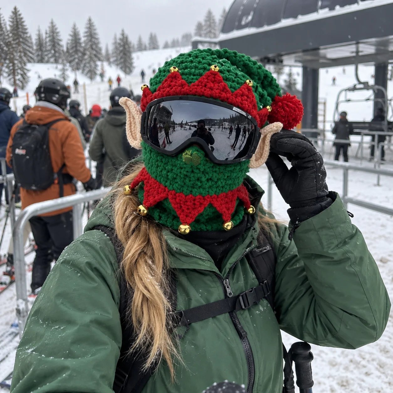 Customer photo of a green Elf mask worn with goggles beside a ski lift Customer photo of a green Elf mask worn with goggles beside a ski lift