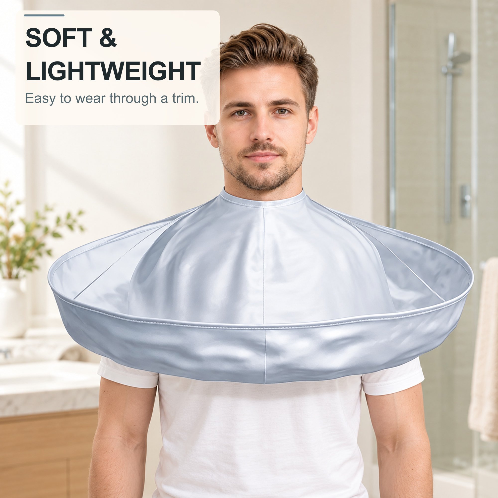Lightweight silver gray hair catcher cape worn during a haircut