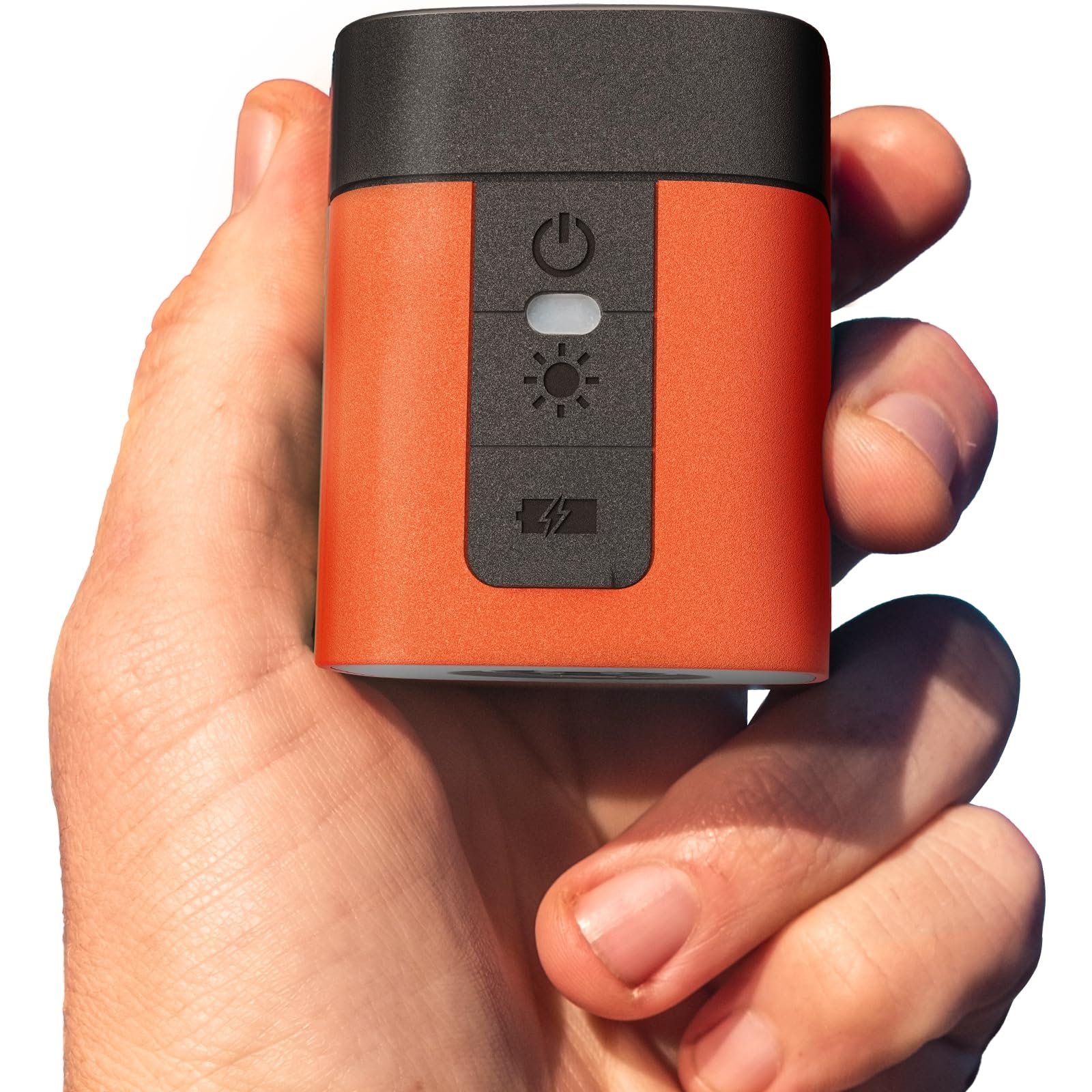 Ultra compact mini electric air pump held in palm of hand