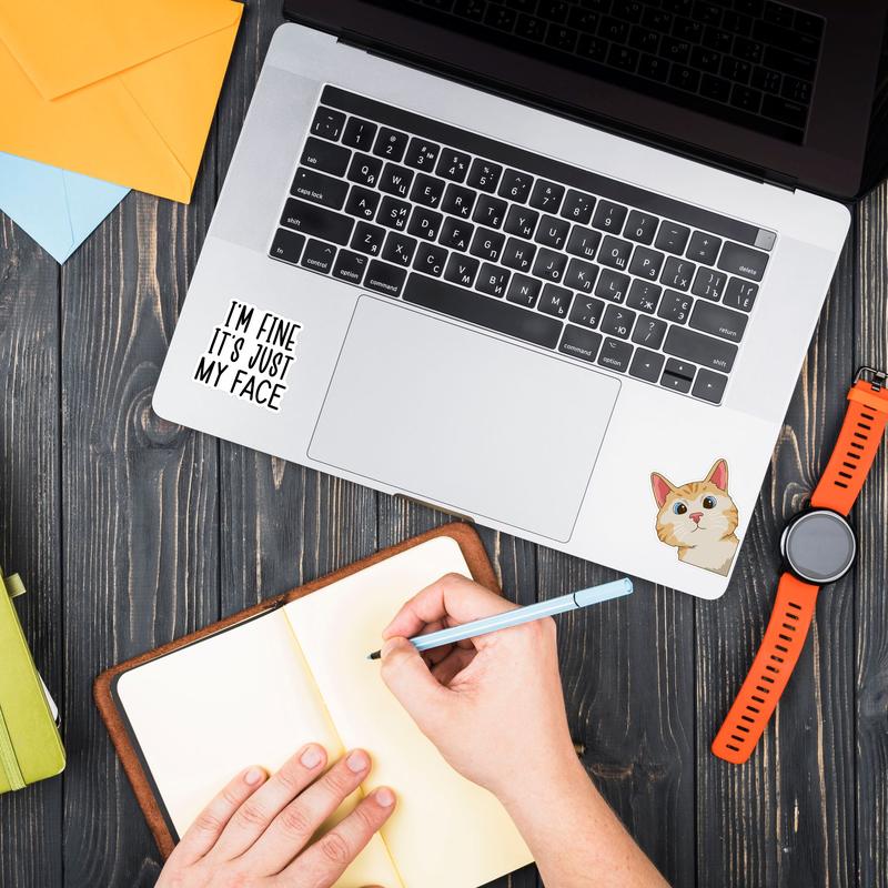 Laptop trackpad area featuring realistic office mood sticker decals