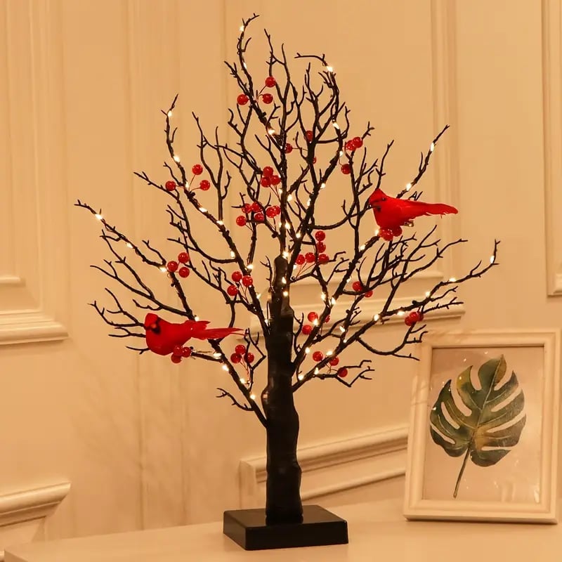 Red berries and bird decorations on the LED vintage glowing tree