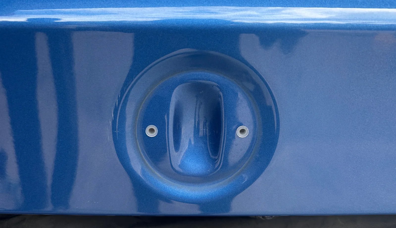 No-drill rear emblem display installation