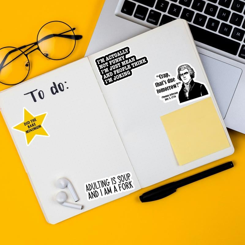 Journal notebook and desk planner decorated with humorous quotes
