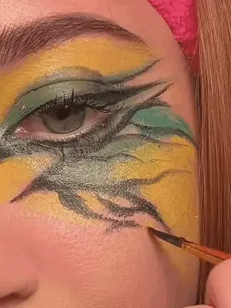 Close-up animated demonstration of a brush adding details to face paint