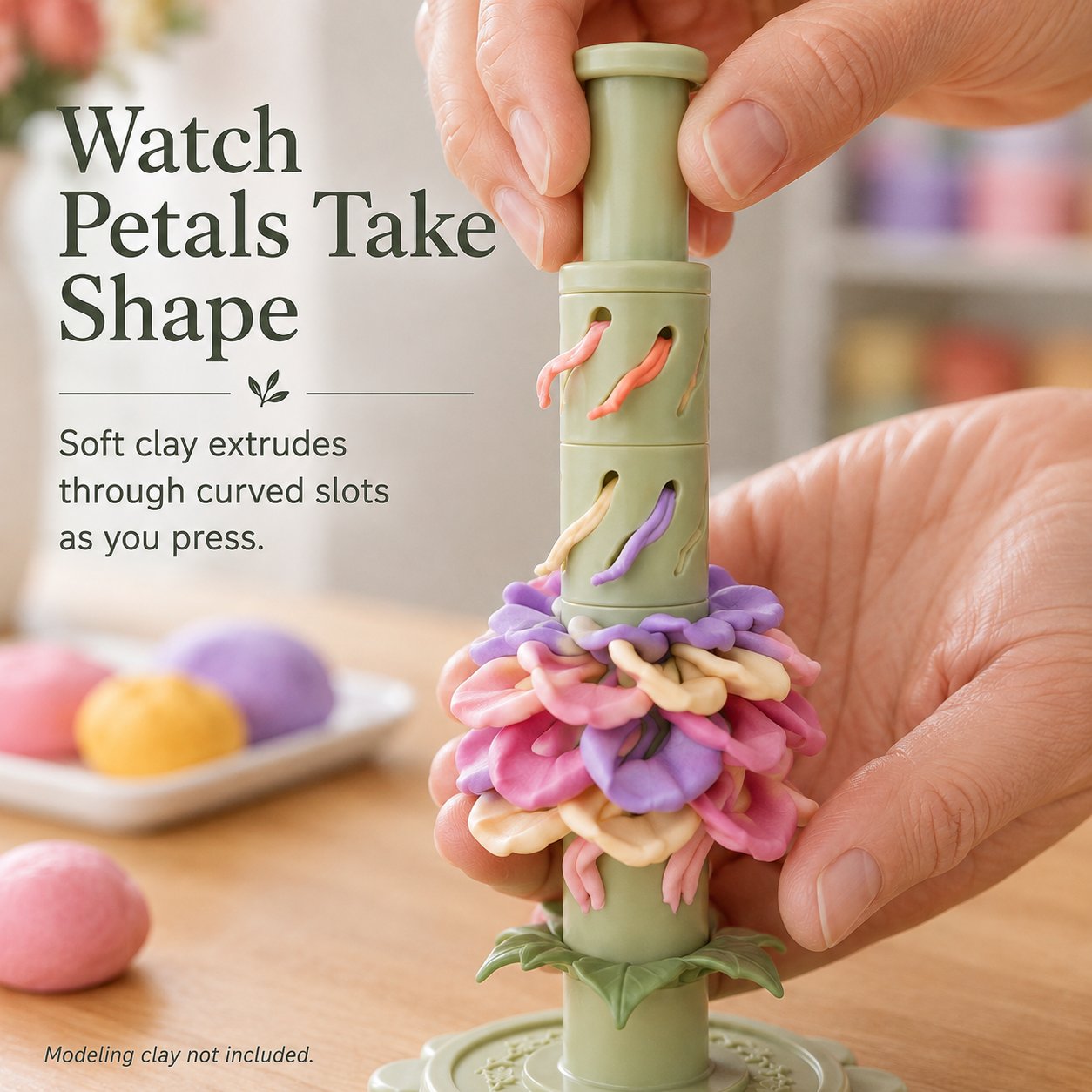 Close view of soft colorful modeling clay emerging through curved shaping sleeve slots