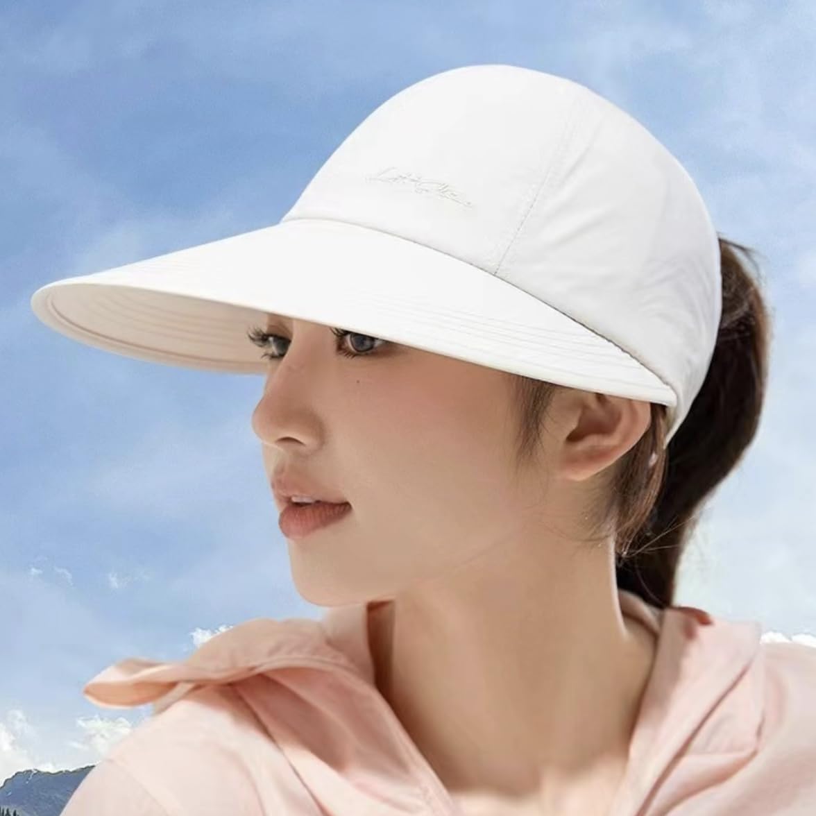 Model wearing white sun hat
