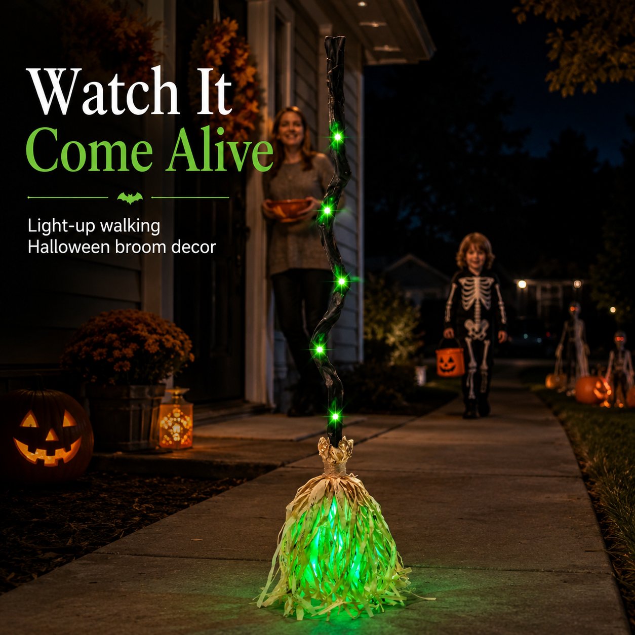 Light-up walking Halloween broom displayed on a decorated front porch at night Light-up walking Halloween broom displayed on a decorated front porch at night