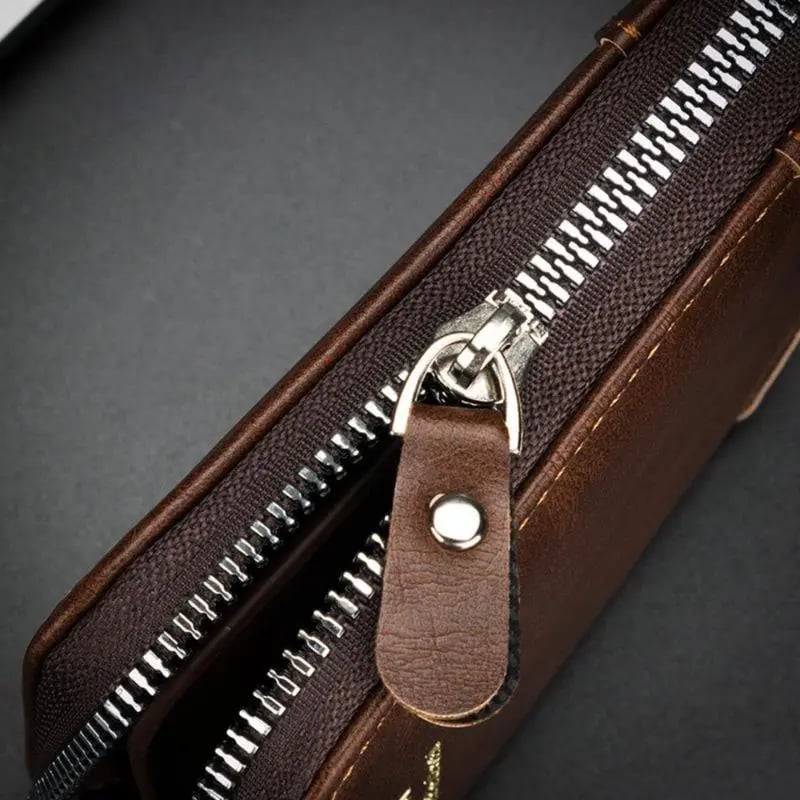 Close up of high quality silver metal zipper track and leather pull tab