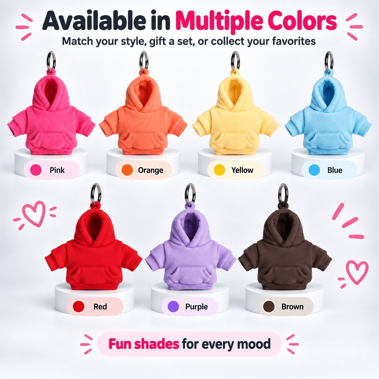 Seven mini hoodie keychain colors: pink, orange, yellow, blue, red, purple, and brown