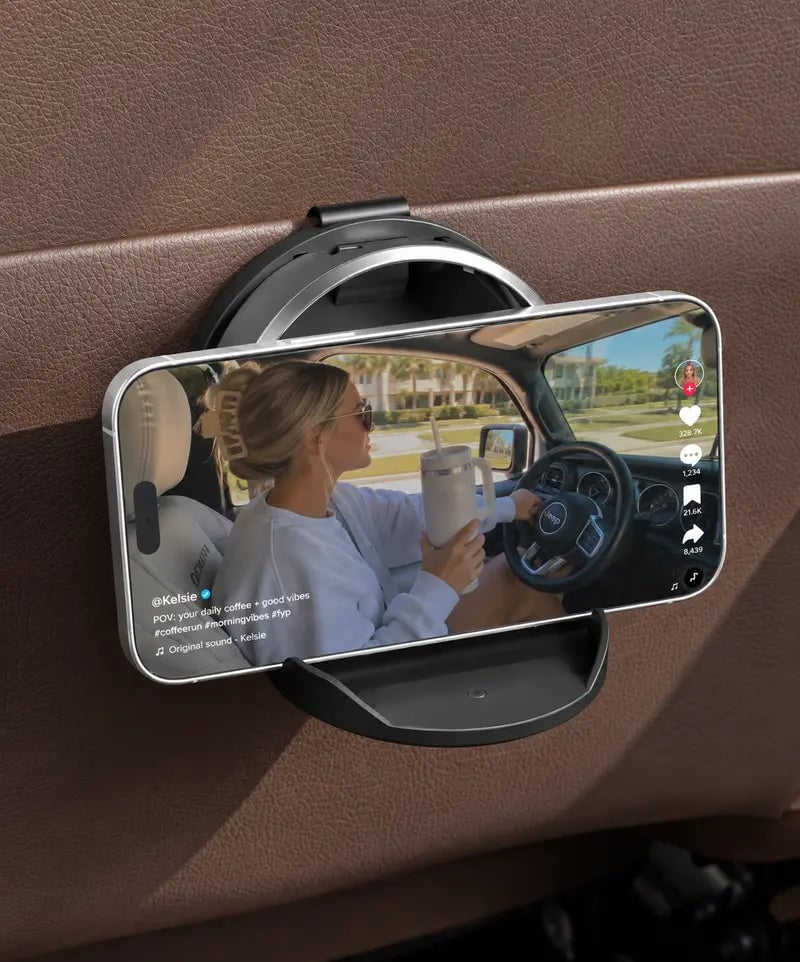 Open foldable cup holder attached to an interior edge with the lower support base unfolded