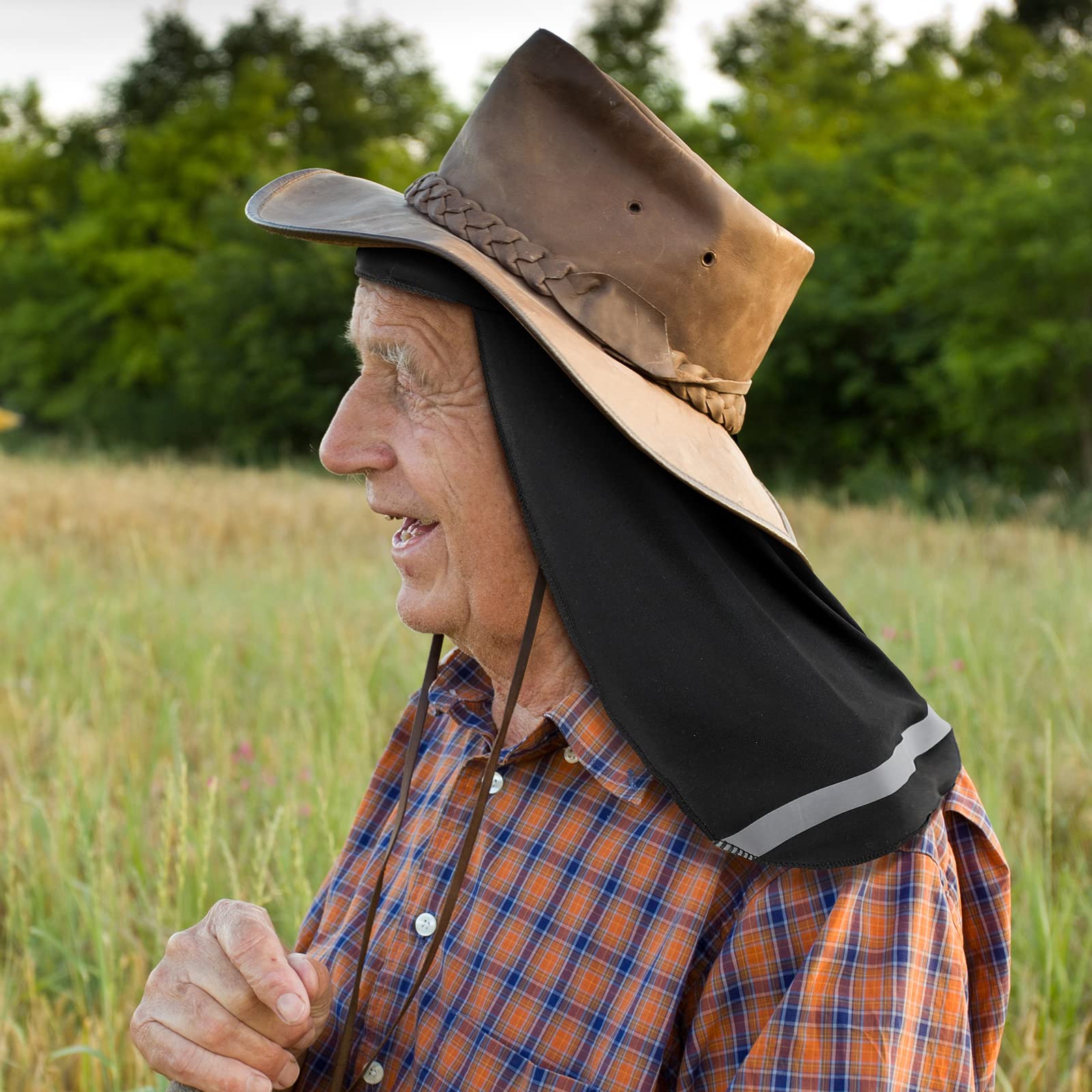 Elderly Man Wearing Black Neck Sun Shade Under Wide Brim Cowboy Hat in the Field Elderly Man Wearing Black Neck Sun Shade Under Wide Brim Cowboy Hat in the Field
