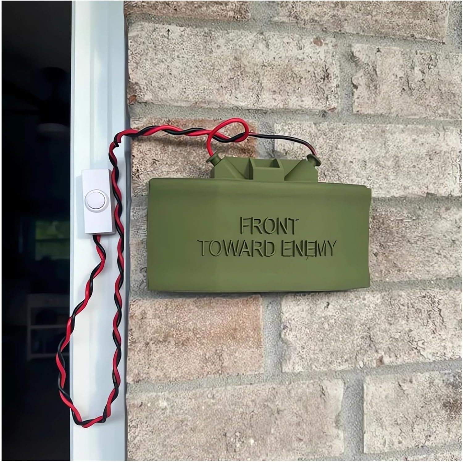 Current Klonzy Ring Cam Claymore Mine Doorbell Prank Sign installed beside a doorbell