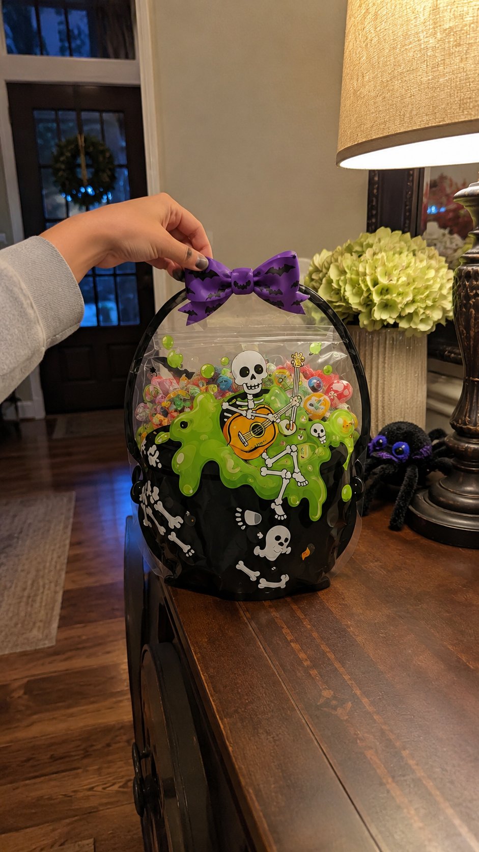 Customer photo of a green slime skeleton Halloween treat bag in a decorated home
