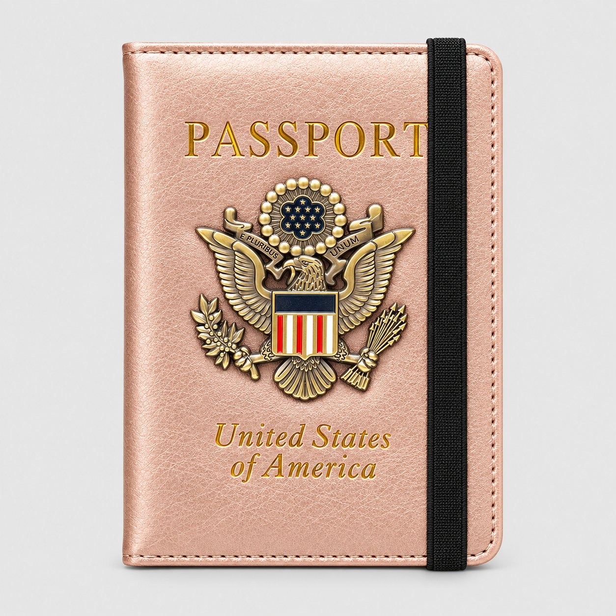 Rose gold passport holder with a 3D metal eagle badge and black elastic closure